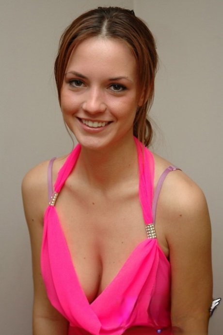 White teen of legal age hikes up her pink dress to expose her bare ass