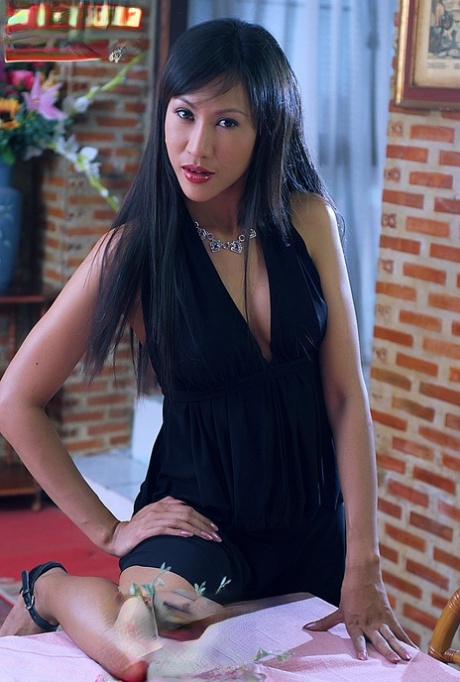 Beautiful Thai girl Nee Nalinda gets naked on a dining table in high heels