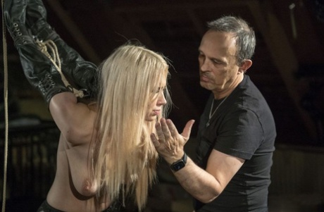 Blond sex slave Roxy Risingstar find herself being tortured while in bondage