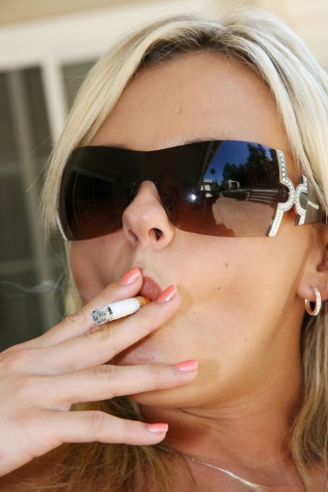 Petite blonde with natural tits Bree Olson smokes and masturbates outdoors