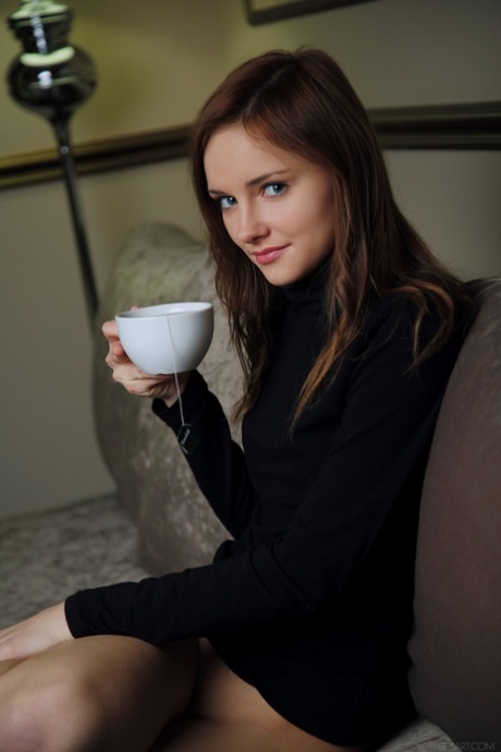 Glamorous teen Cathleen A strips and masturbates after having a cup of tea