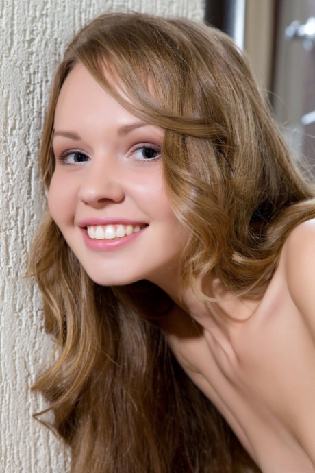 Sweet teen with an amazing butt Virginia Sun undresses and poses nude