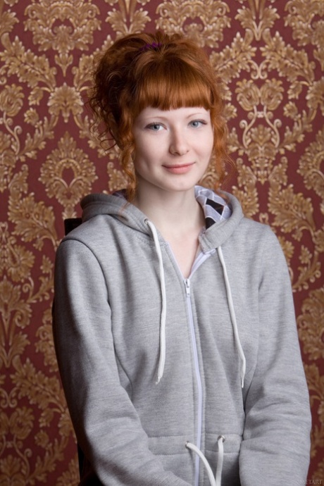 Ginger girl Rochelle A exposes her slim figure and hairy pussy on a lazy bag