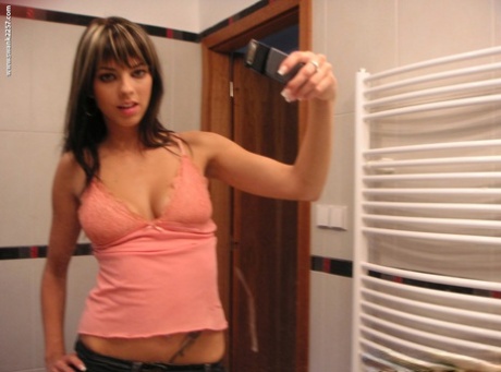 Hot girlfriend Mellie Swan takes selfies of her big natural tits in the mirror