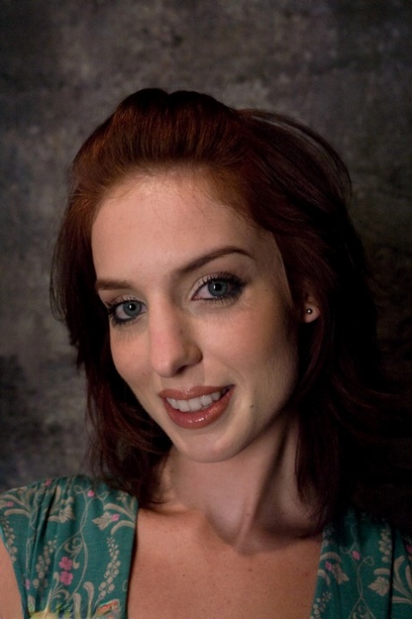 Cute redheaded wife Riley Shy gets tied up and spanked in a BDSM dungeon